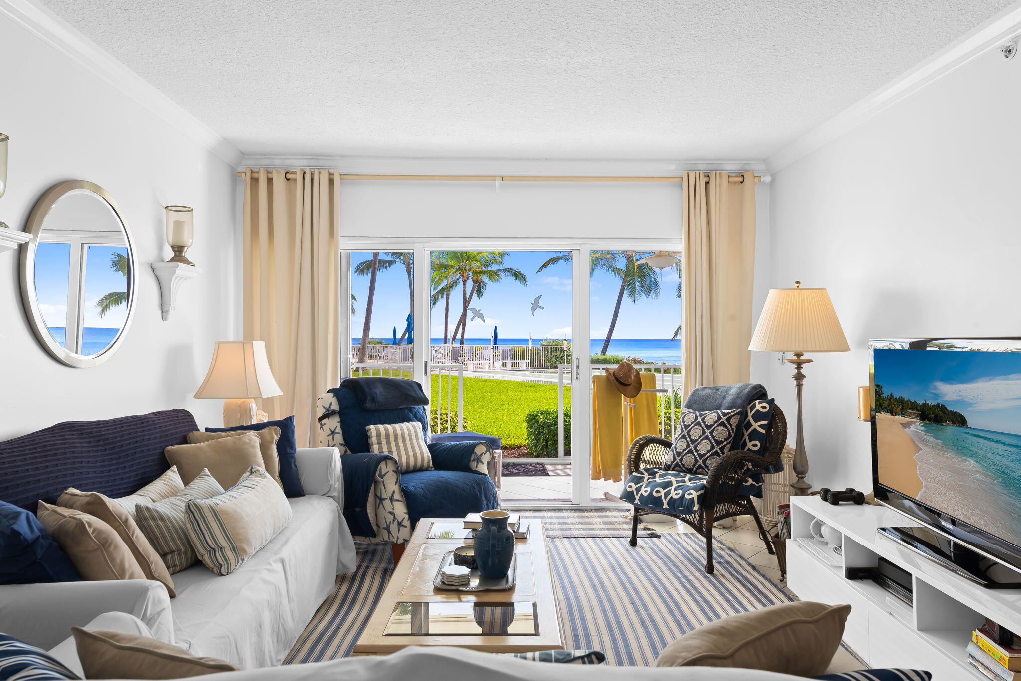 3101 South Ocean Boulevard, Unit 102 Highland Beach, FL 33487 - Photo 6 of 19 a living room with furniture and a large window