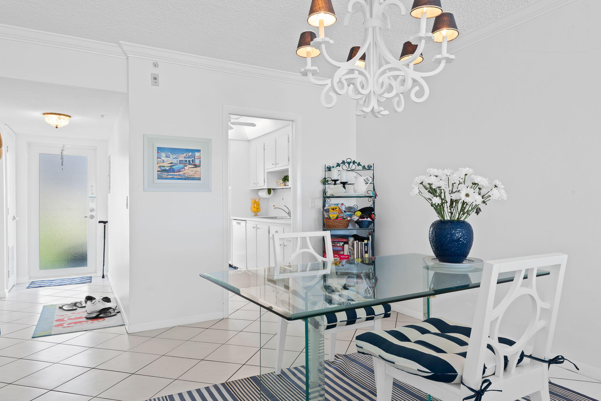 3101 South Ocean Boulevard, Unit 102 Highland Beach, FL 33487 - Photo 9 of 19 a view of a dining room with furniture and chandelier