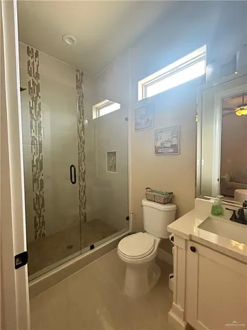 a bathroom with a toilet sink and shower