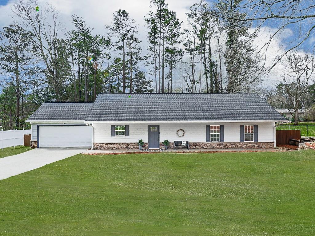 1002 Brackett Road Marietta, GA 30066 - Photo 1 of 1 front view of house with a yard