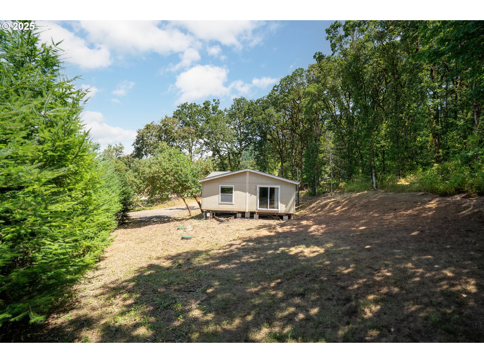 31795 Northeast Wilsonville Road Newberg, OR 97132 - Photo 5 of 26 a view of a house with a yard