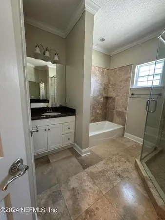 a utility room with a sink and washing machine