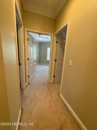 a bathroom with a granite countertop toilet and a sink