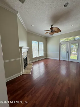 a view of a kitchen with wooden floor