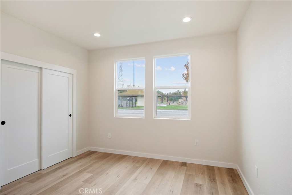 243 East 3rd Street Tracy, CA 95376 - Photo 20 of 29 a view of room with window and hardwood floor