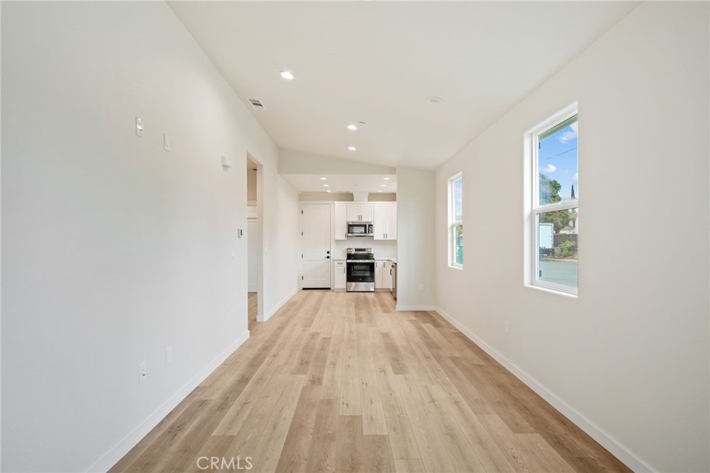 243 East 3rd Street Tracy, CA 95376 - Photo 29 of 29 a view of a big room with wooden floor and windows