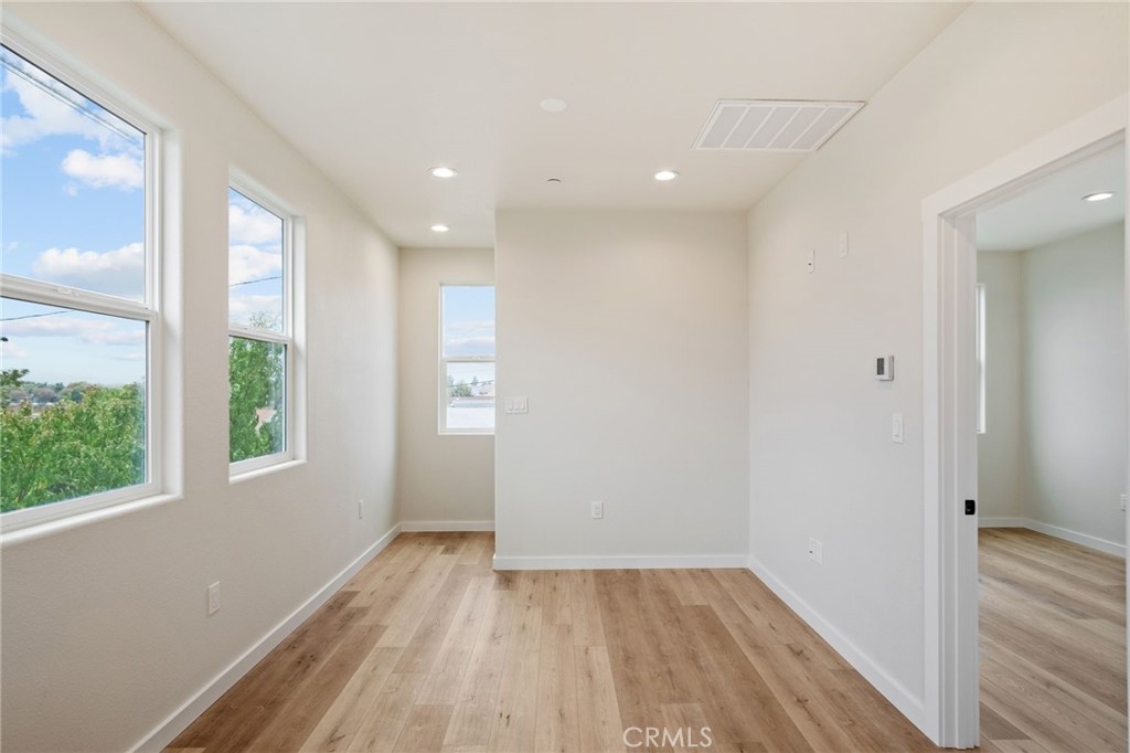243 East 3rd Street Tracy, CA 95376 - Photo 10 of 29 a view of a room with wooden floor and window