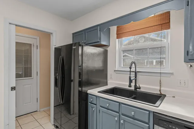 a bathroom with a window and mirror