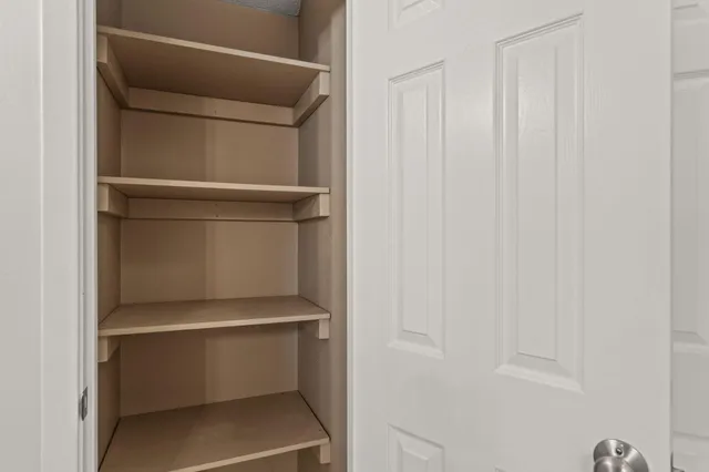 a view of a room with racks on the wall