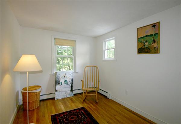 8 Longfellow Road Wayland, MA 01778 - Photo 19 of 24 a room with a chair and a window