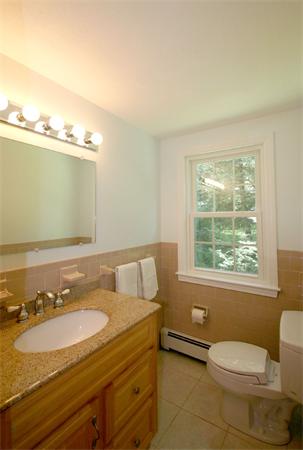 8 Longfellow Road Wayland, MA 01778 - Photo 21 of 24 a bathroom with a granite countertop sink and a mirror
