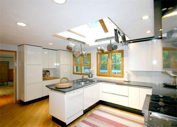 8 Longfellow Road Wayland, MA 01778 - Photo 7 of 24 a kitchen with a stove and a white cabinets