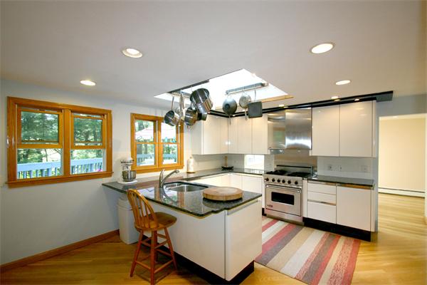 8 Longfellow Road Wayland, MA 01778 - Photo 9 of 24 a kitchen with a stove a sink and a refrigerator