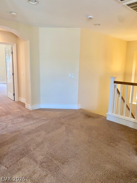 159 Tall Ruff Drive Las Vegas, NV 89148 - Photo 12 of 31 Plush carpeting anchors this versatile upstairs landing, flanked by an elegant wooden staircase railing.