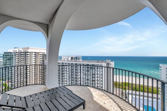 a view of balcony with wooden floor