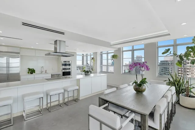 a kitchen with a table and chairs in it