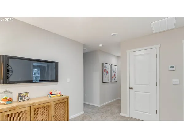 a bathroom with a tub sink vanity and mirror