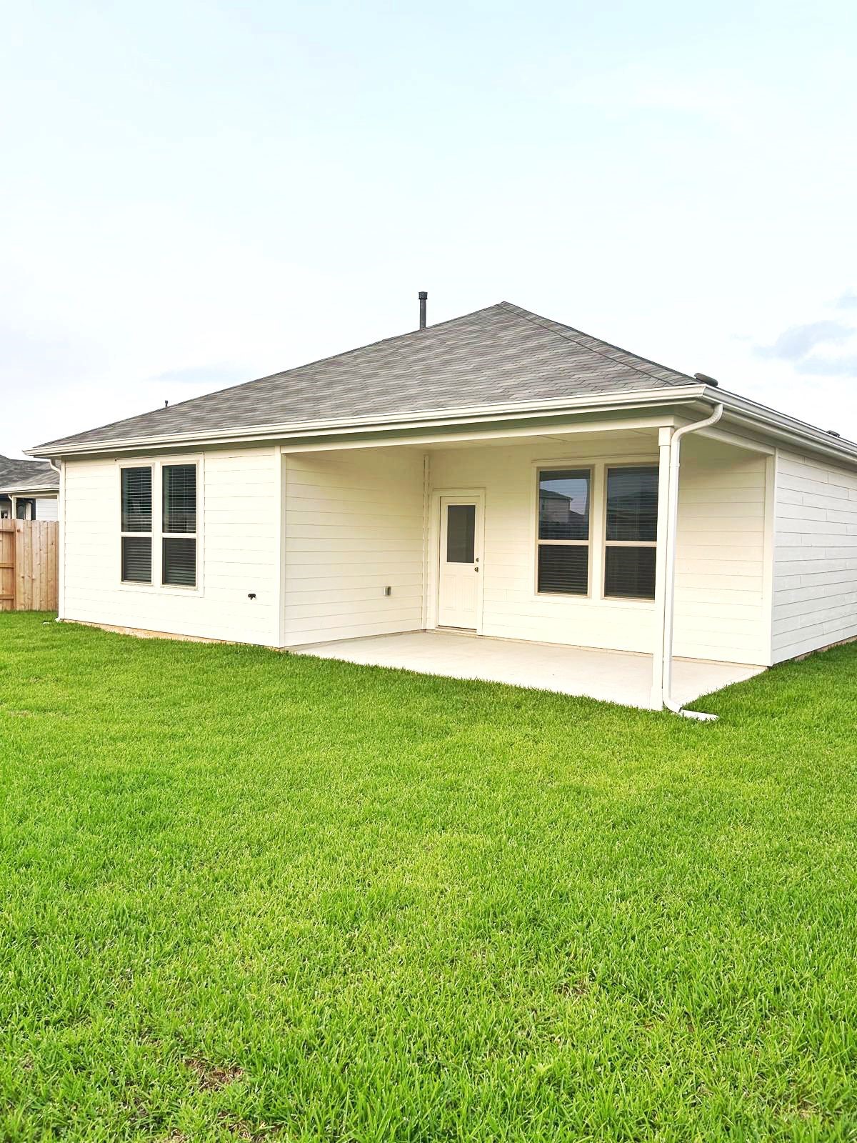 14973 Rustic Moon Road Conroe, TX 77302 - Photo 21 of 22 a house view with a backyard space
