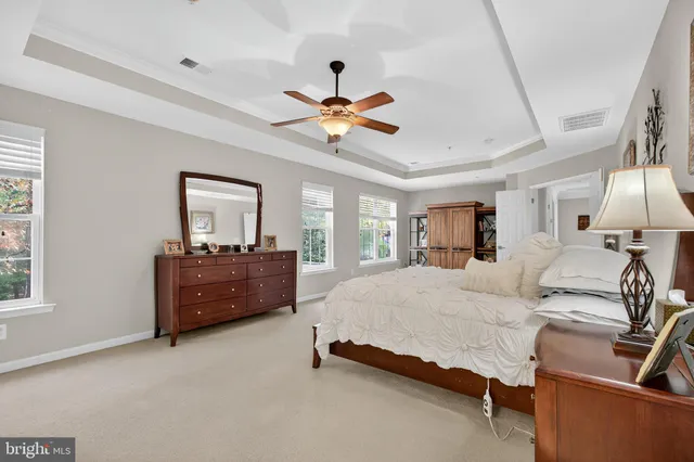 a view of a swimming pool with an outdoor seating