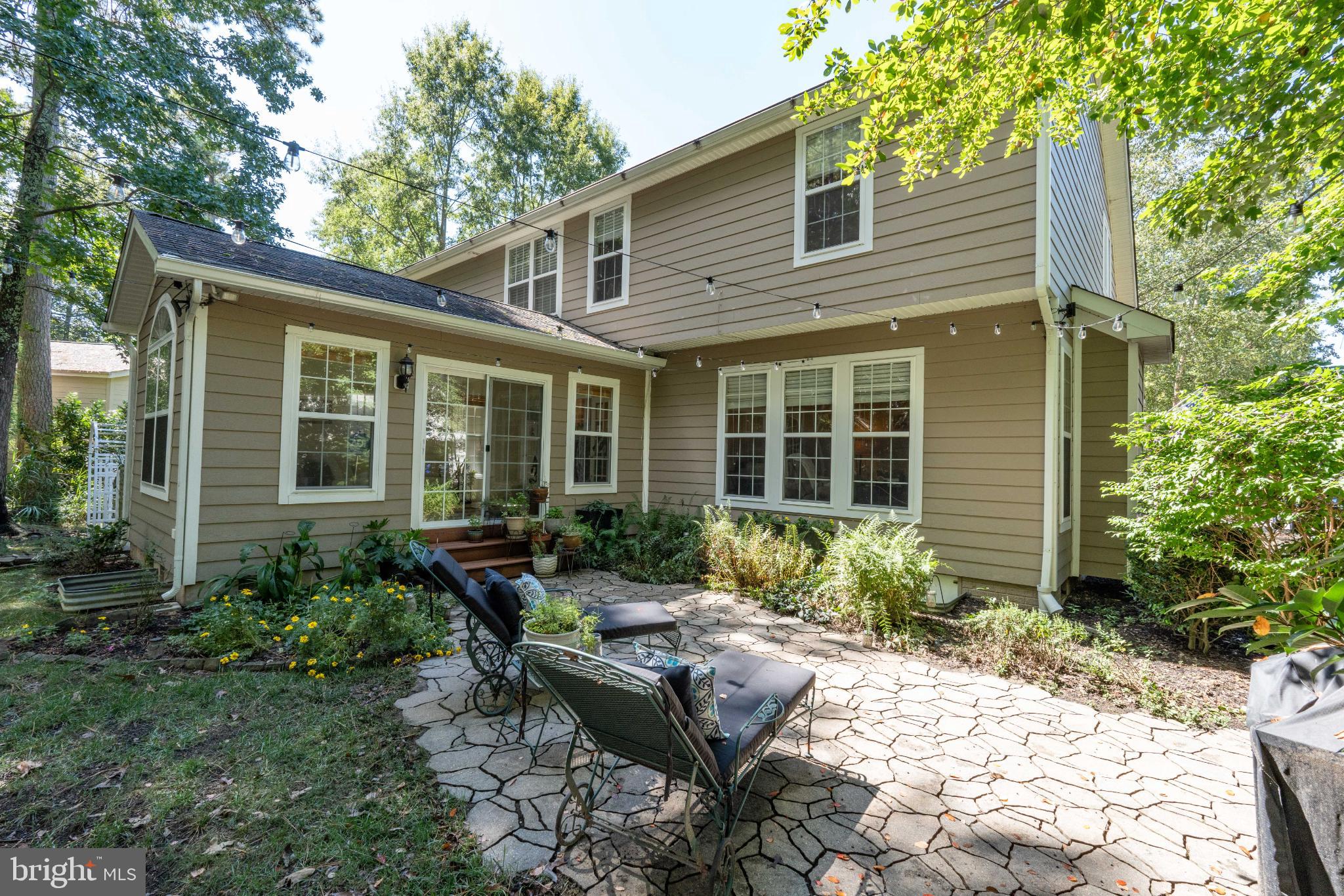 11215 Lord Baltimore Drive Issue, MD 20645 - Photo 25 of 38 Charming backyard retreat with lush greenery.