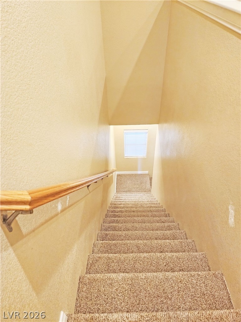 1421 Star Road, Unit 2 Pahrump, NV 89048 - Photo 14 of 33 Staircase with a textured wall