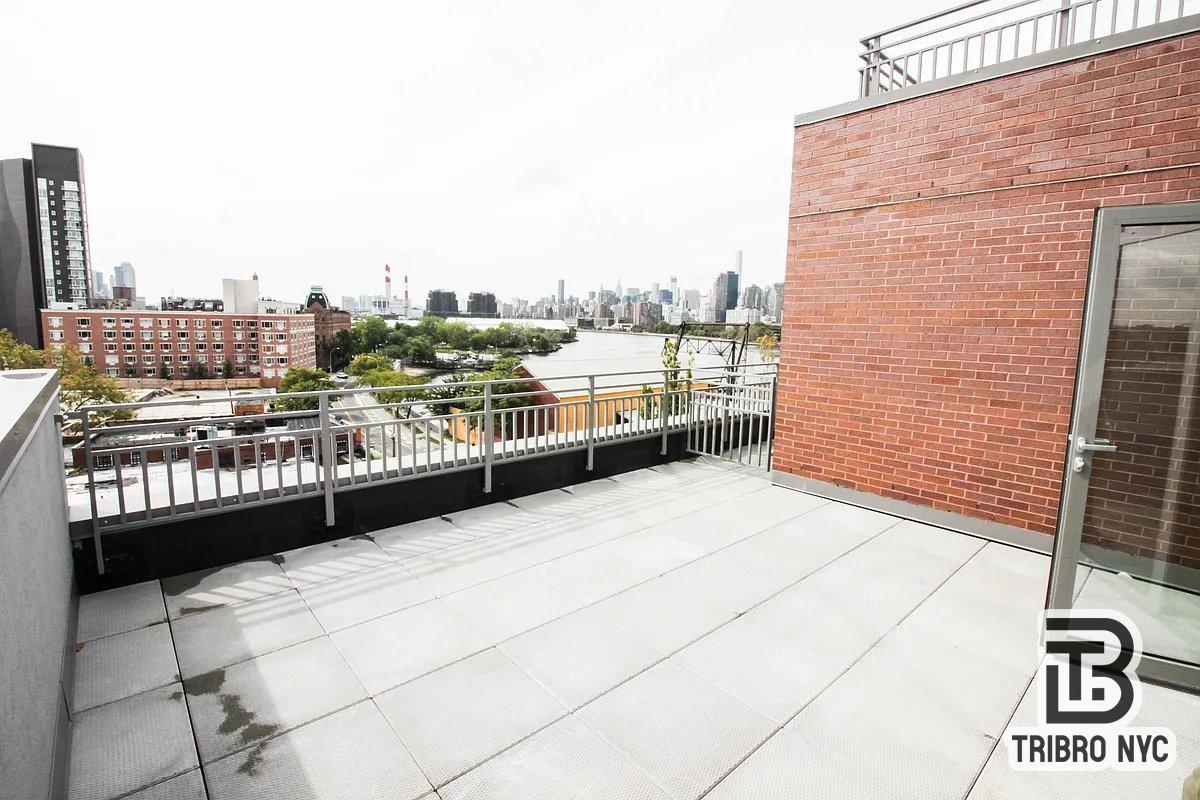 11-05 30th Road, Unit 7 Queens, NY 11102 - Photo 2 of 7 a view of balcony with city view