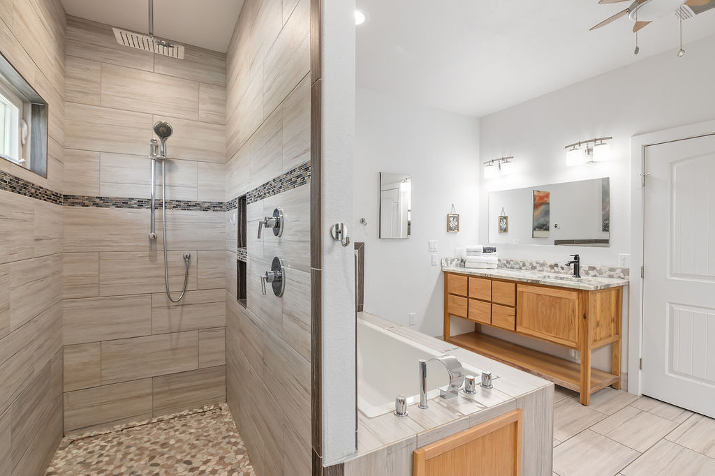 13326 Trautwein Road Austin, TX 78737 - Photo 20 of 38 Full bathroom with a tile shower, a garden tub, a ceiling fan, and vanity