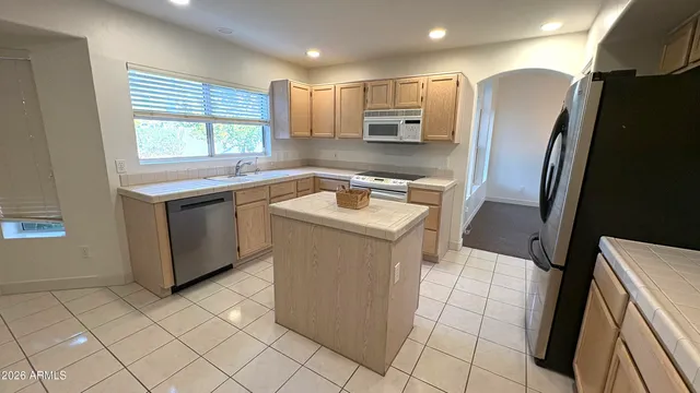 a bathroom with a sink a vanity and a mirror