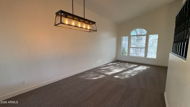 a kitchen with a sink a stove top oven cabinets and a counter top space