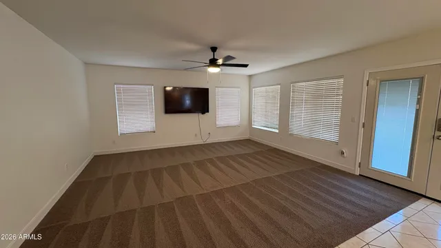 a bathroom with a granite countertop sink mirror and toilet