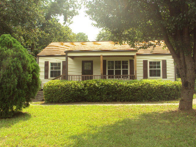1311 Davis Avenue Perry, GA 31069 - Photo 1 of 1 a front view of house with yard and green space