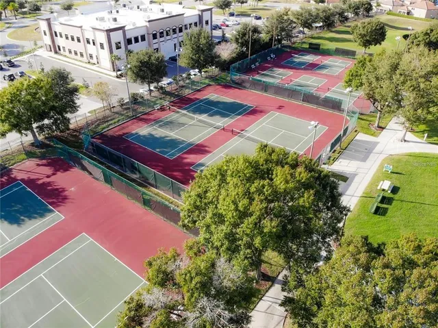 an aerial view of a pool patio swimming pool and mountain view