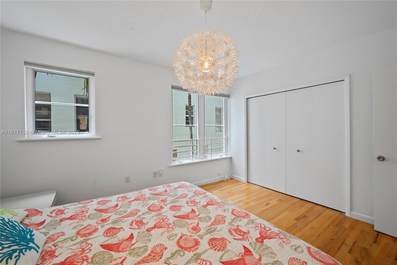 1018 Meridian Avenue, Unit 5 Miami Beach, FL 33139 - Photo 15 of 18 a bedroom with bed and a window