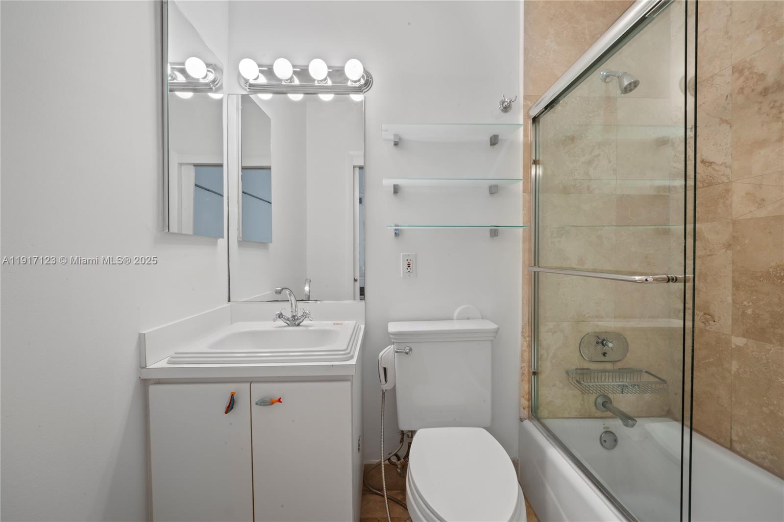1018 Meridian Avenue, Unit 5 Miami Beach, FL 33139 - Photo 18 of 18 a bathroom with a sink toilet tub and shower