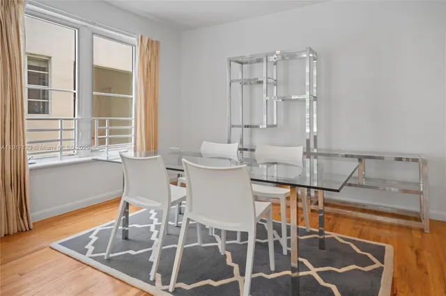 a dining room with table and chairs
