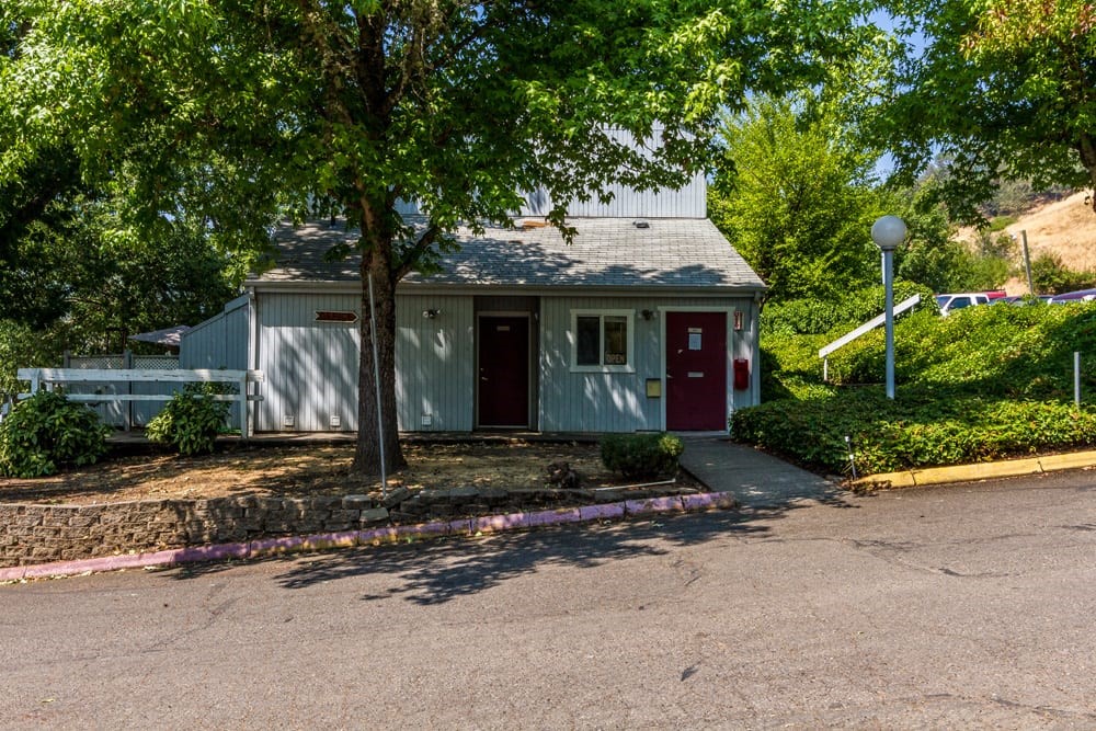 721 Southeast Meadowlark Avenue Myrtle Creek, OR 97457 - Photo 3 of 10 a front view of a house with garden