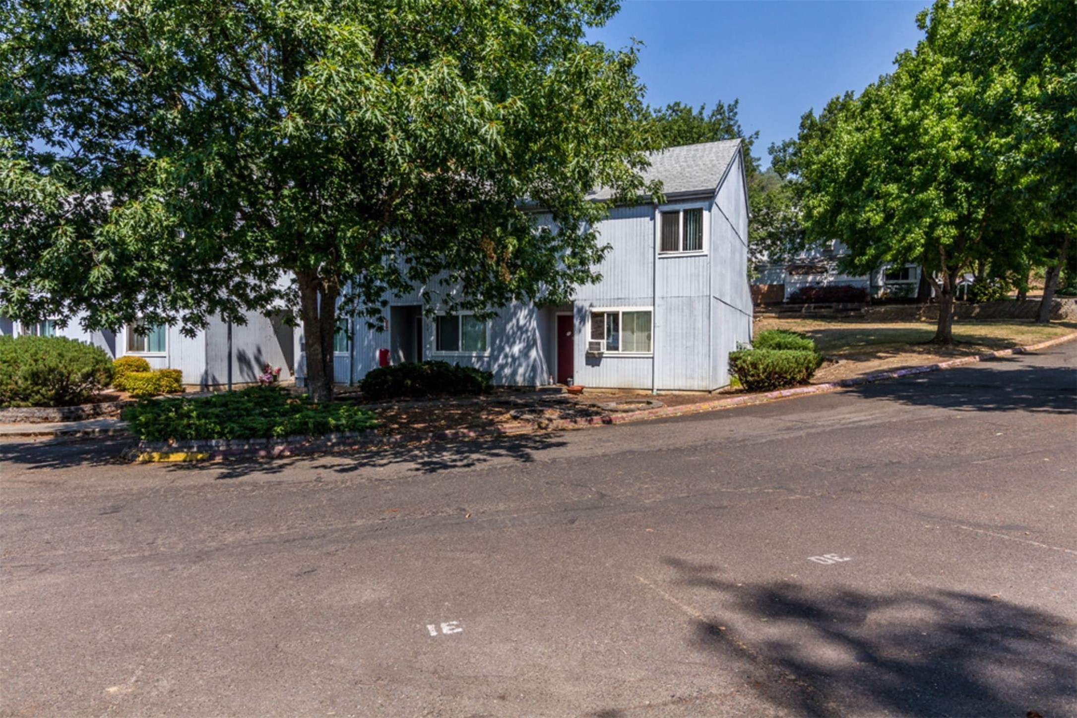 721 Southeast Meadowlark Avenue Myrtle Creek, OR 97457 - Photo 7 of 10 a front view of a house with a yard and a garage