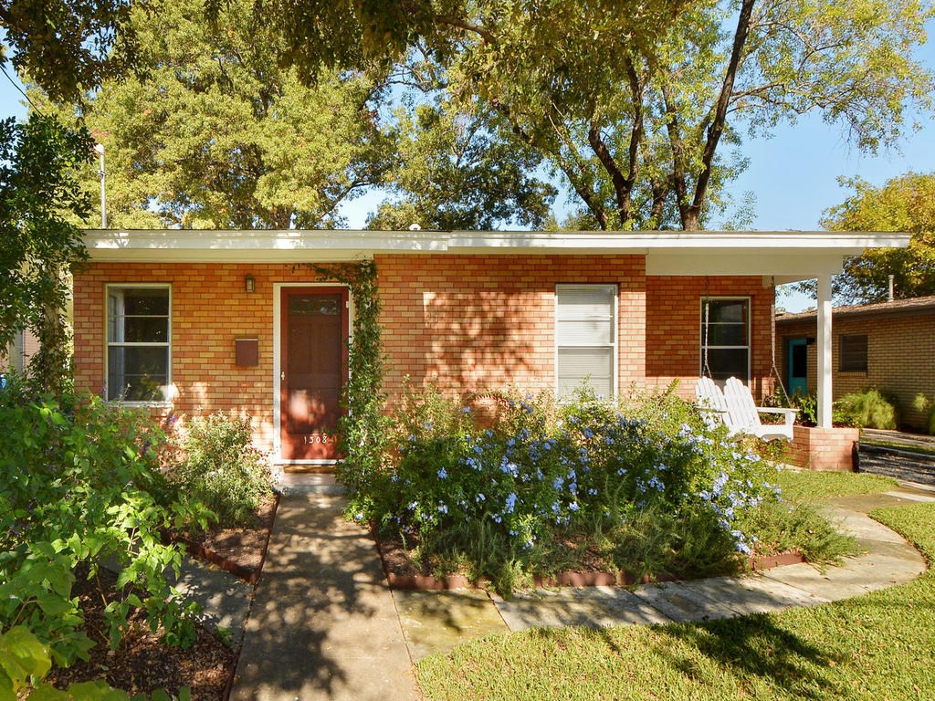1308 Ruth Avenue Austin, TX 78757 - Photo 1 of 1 front view of a house with a yard