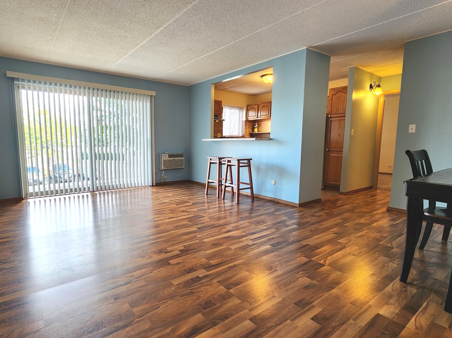 588 Fairway View Drive, Unit 2E Wheeling, IL 60090 - Photo 2 of 13 an empty room with wooden floor and windows