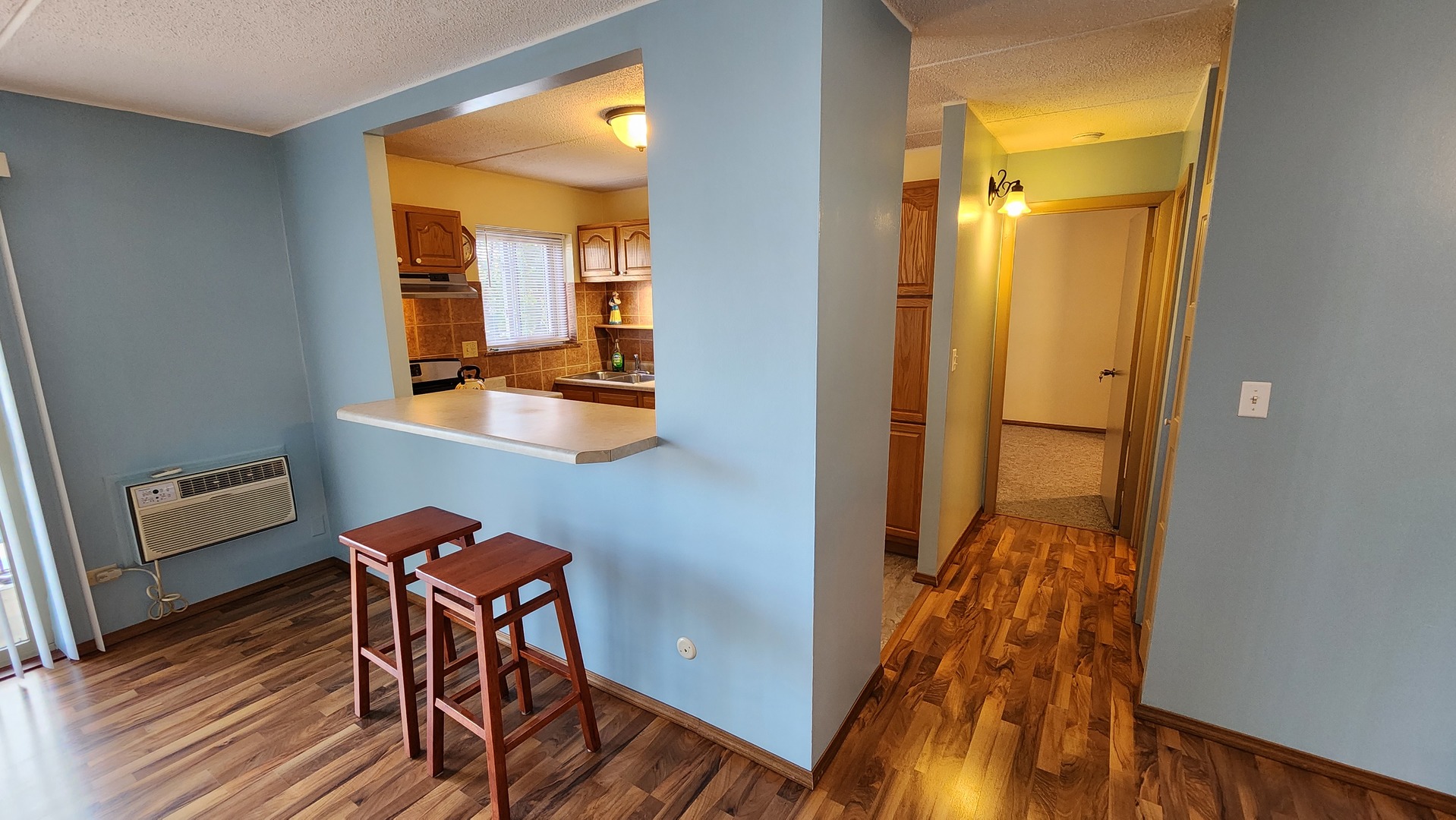 588 Fairway View Drive, Unit 2E Wheeling, IL 60090 - Photo 3 of 13 wooden floor and utility room with wooden floor
