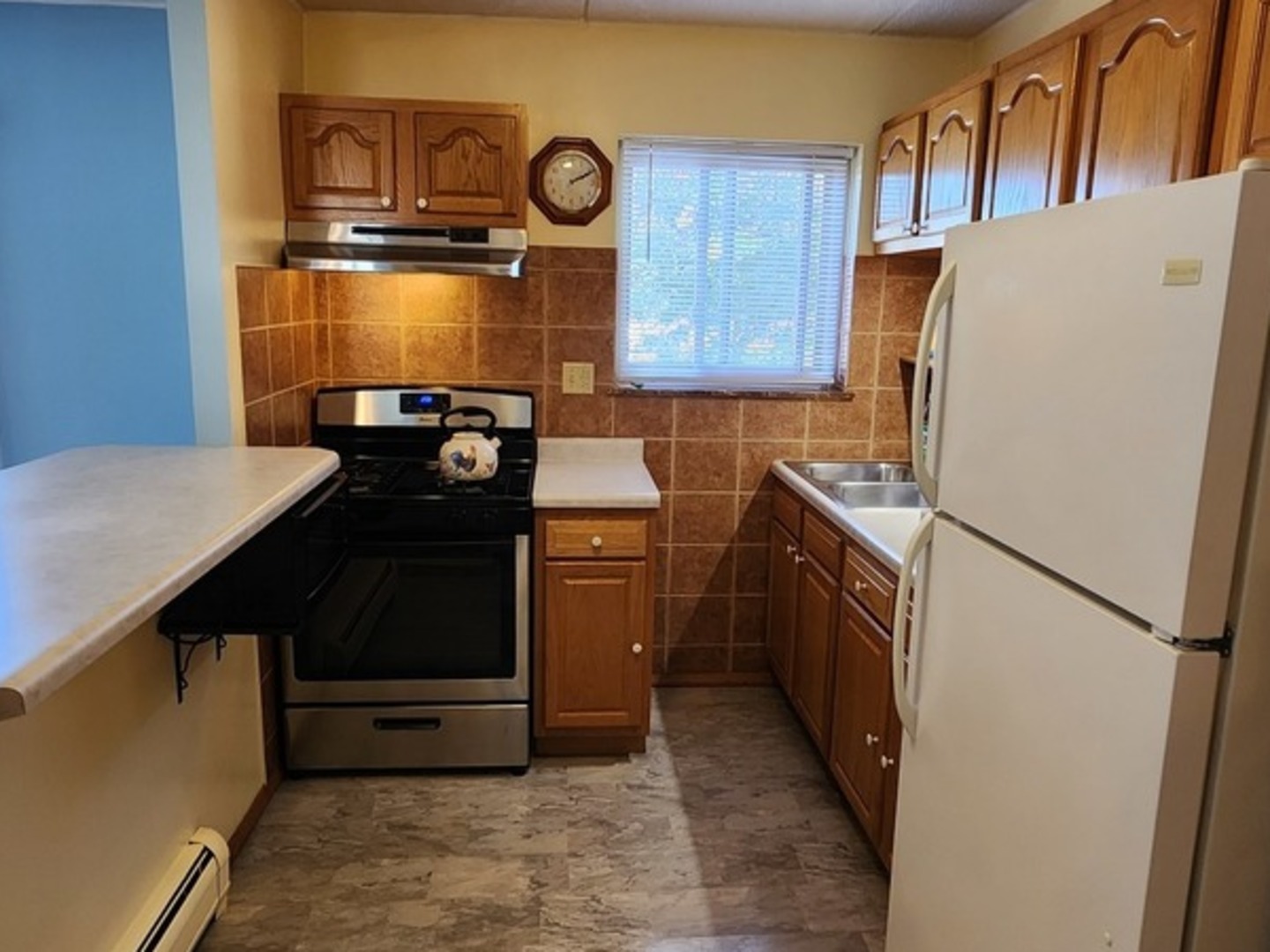 588 Fairway View Drive, Unit 2E Wheeling, IL 60090 - Photo 5 of 13 a kitchen with a refrigerator and a stove