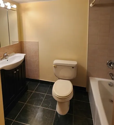 a bathroom with a toilet and a sink