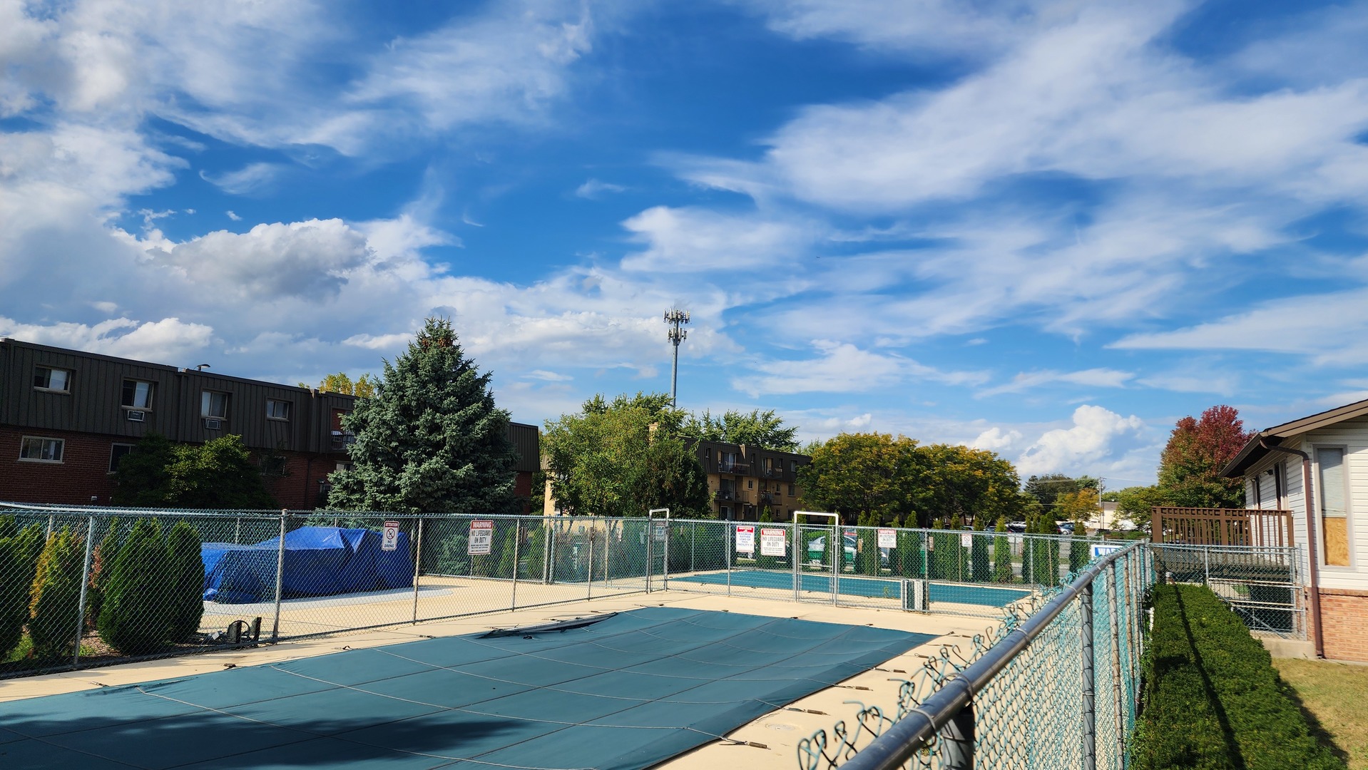588 Fairway View Drive, Unit 2E Wheeling, IL 60090 - Photo 10 of 13 a view of a swimming pool with a patio