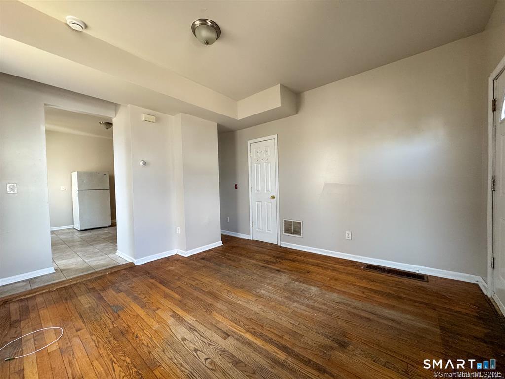 40 Jane Street Bridgeport, CT 06608 - Photo 26 of 30 a view of an empty room and wooden floor