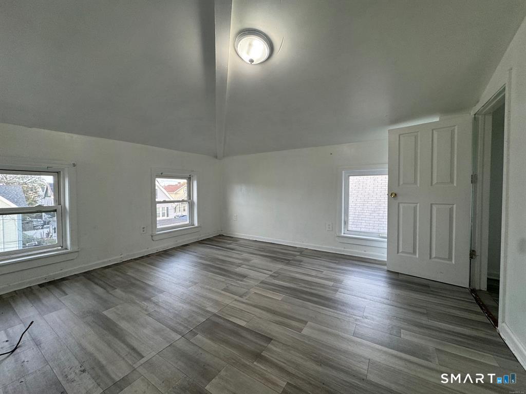 40 Jane Street Bridgeport, CT 06608 - Photo 10 of 30 an empty room with wooden floor and windows