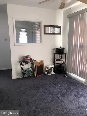 a view of a livingroom with storage and utility