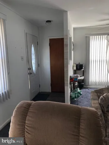 a bedroom with a bed and potted plant