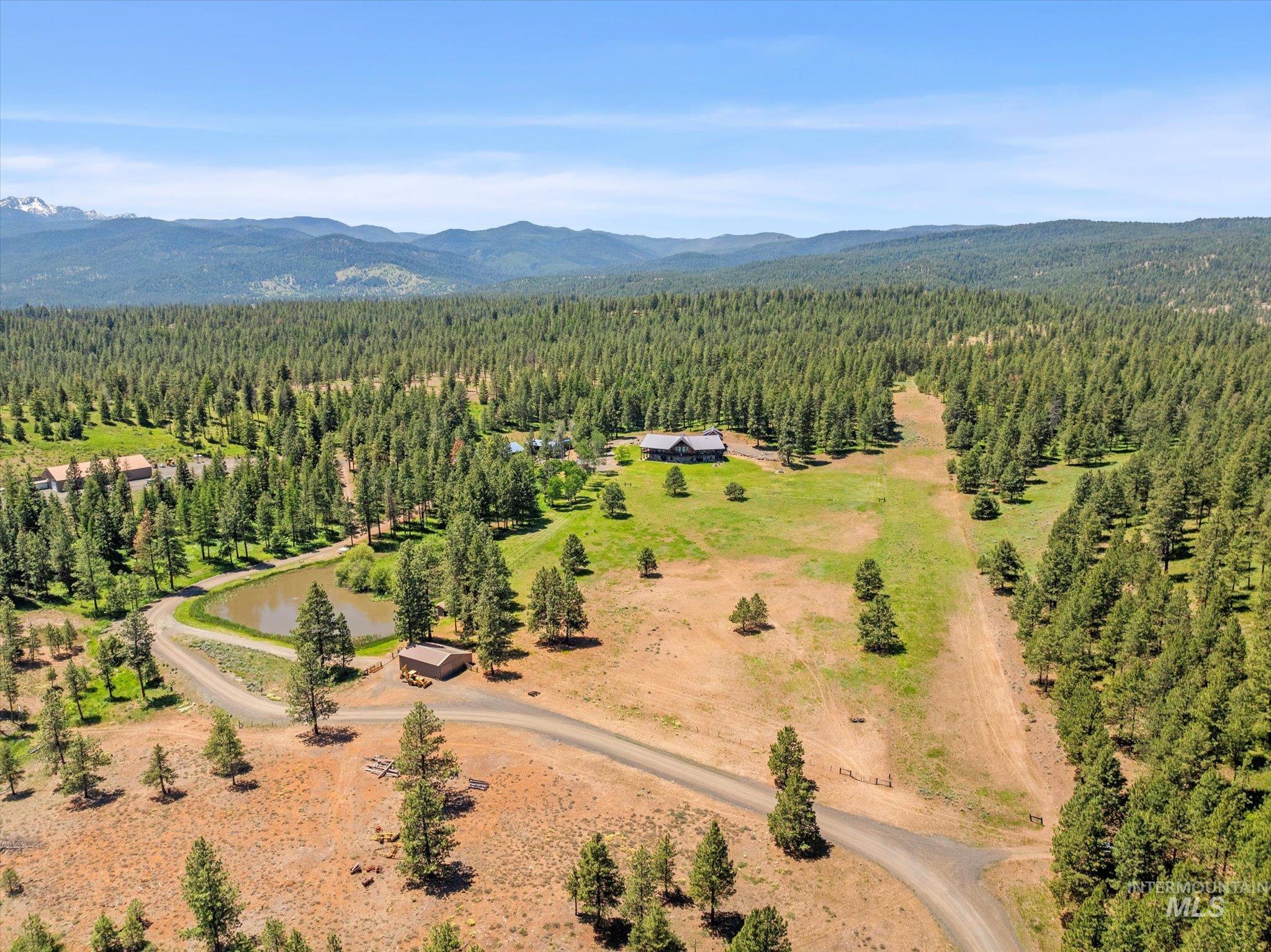 62924 Wolf Creek Lane North Powder, OR 97867 - Photo 6 of 50 Bird's eye view of a heavily wooded area and mountains