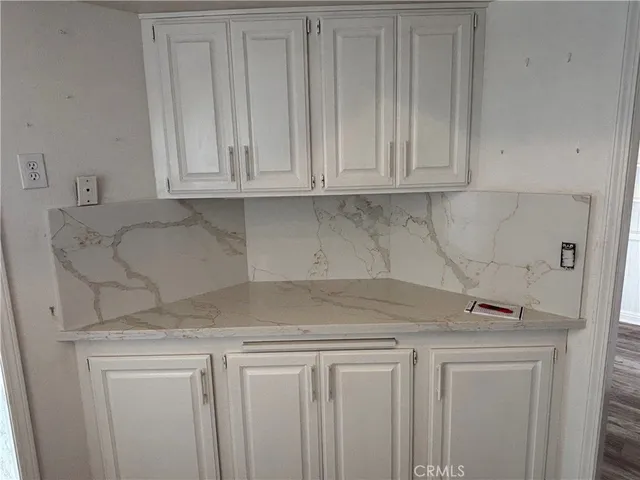 a view of hallway with wooden floor