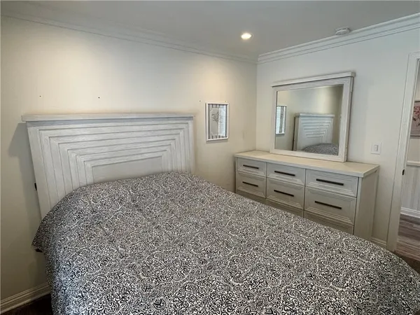 a bedroom with a bed and a table